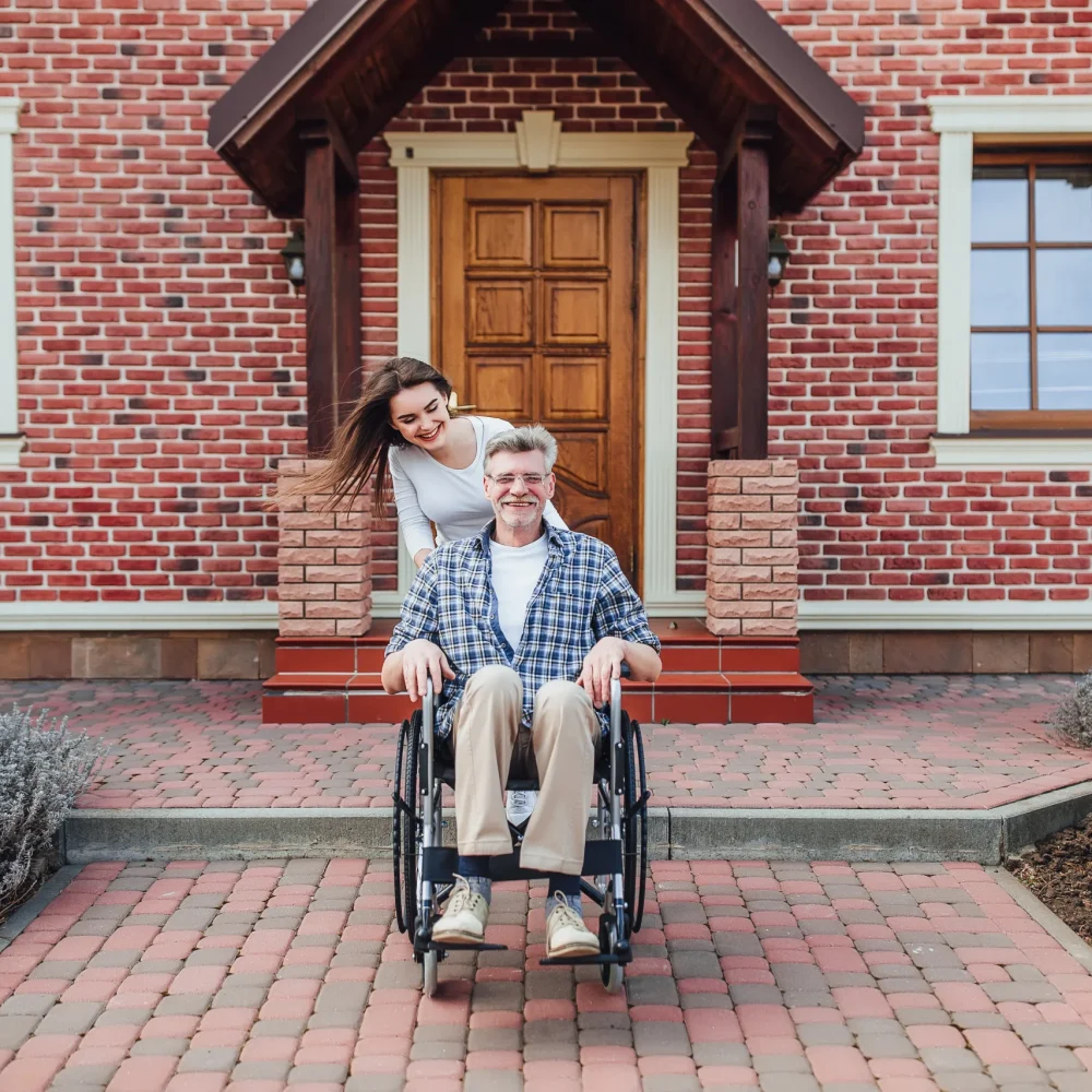 enjoying-family-time-elderly-man-wheelchair-smiling-daughter-garden