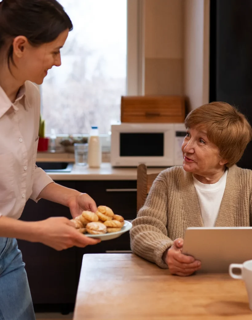female-caretaker-her-client-s-house-taking-care-elderly-person (1)